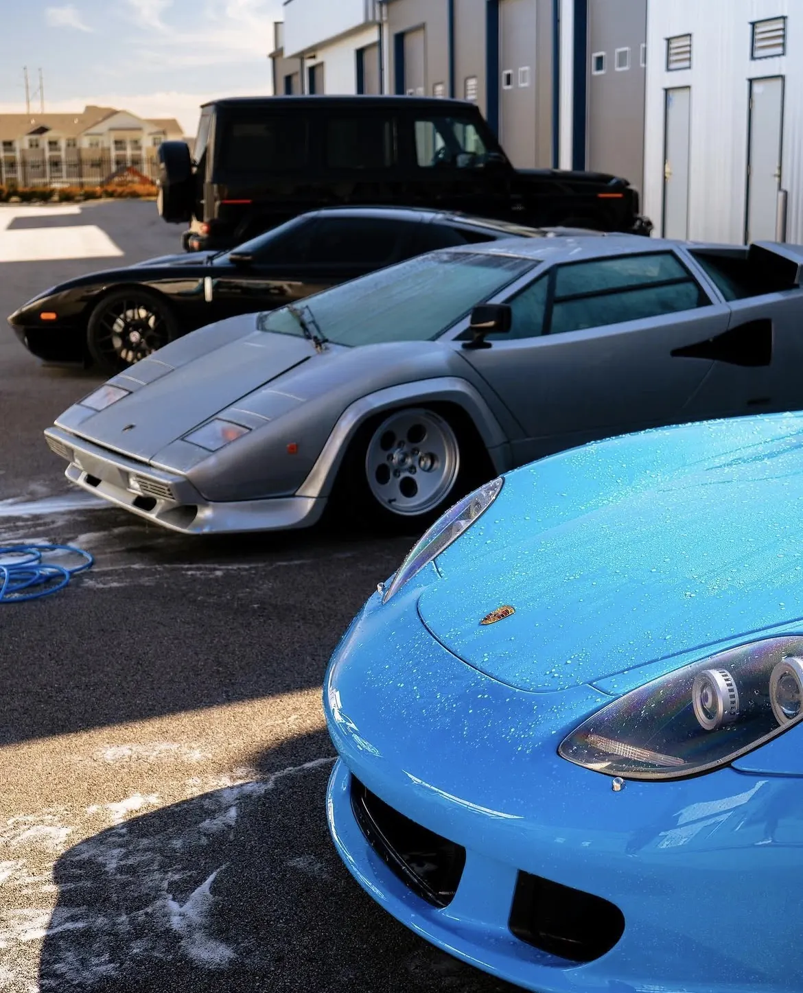 Detailed exotic cars including Lamborghini Countach and Porsche